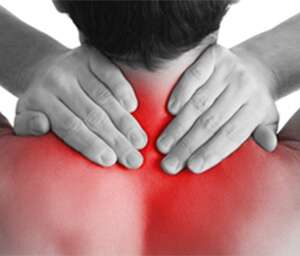A person holding the back of their neck, highlighting neck and upper back pain in red