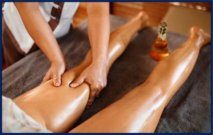 Image of a person receiving a leg spa massage, with their legs submerged in a soothing bath of warm water and being massaged for relaxation and rejuvenation.