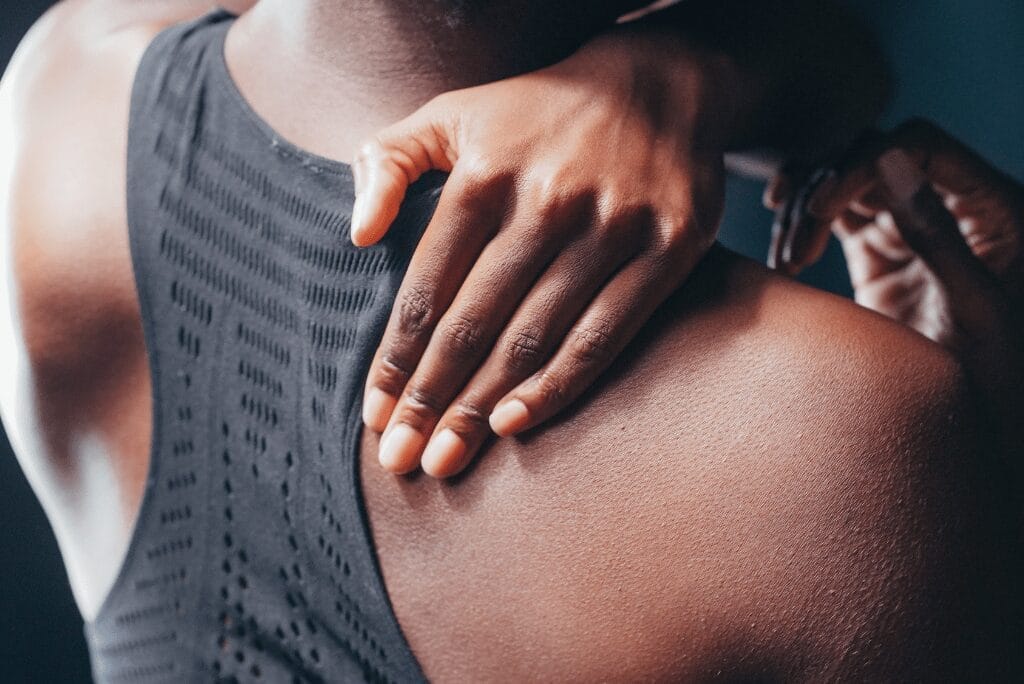 Athlete holding back in pain after sports injury
